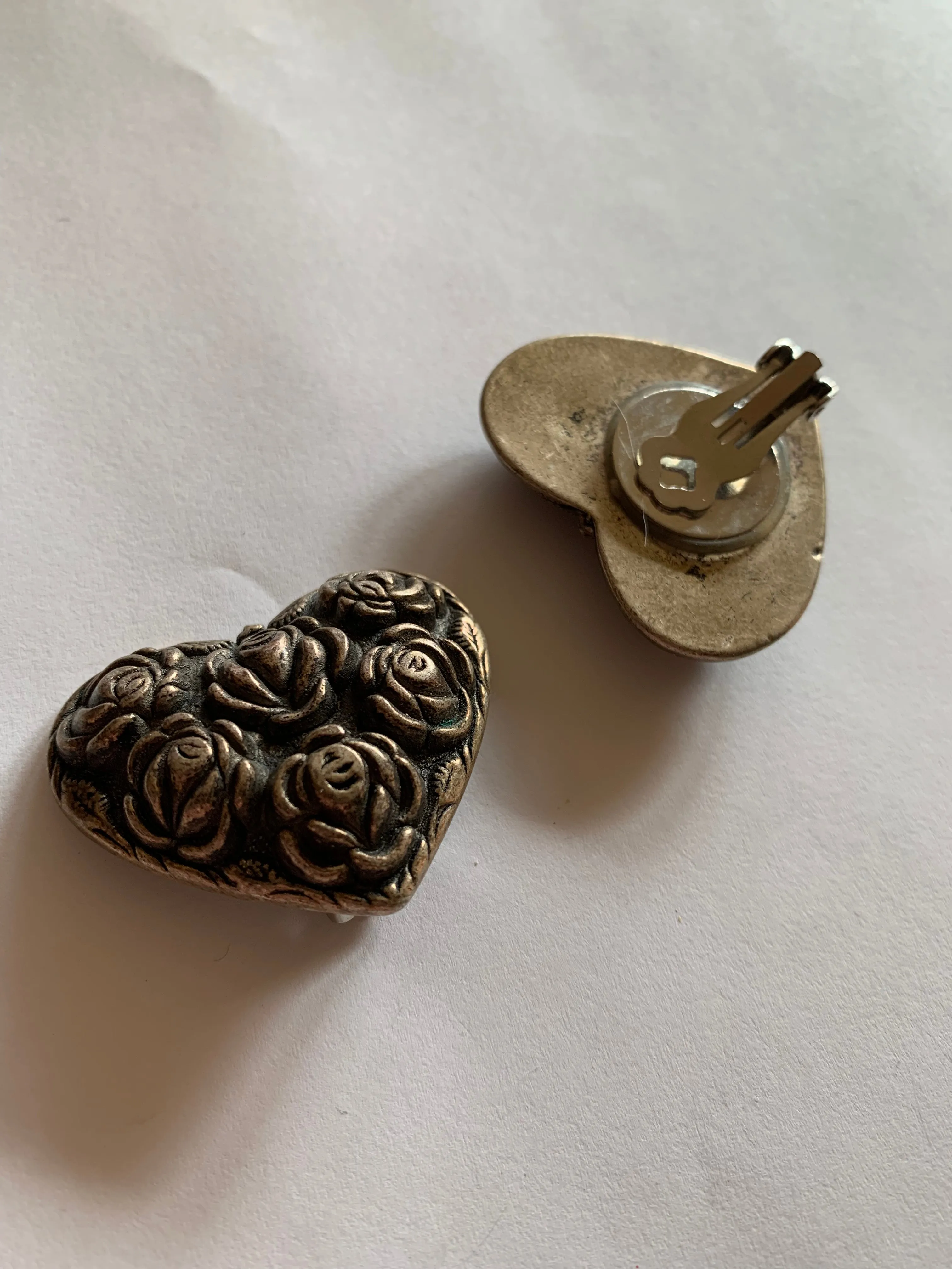 Baroque Textured Rose Design Heart Shaped Metal Clip Earrings circa 1980s